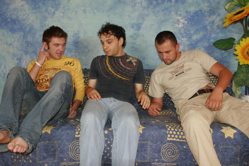 Christian, Kevin, and Isaac in a hot three-way kiss with hairy chests pressed together
