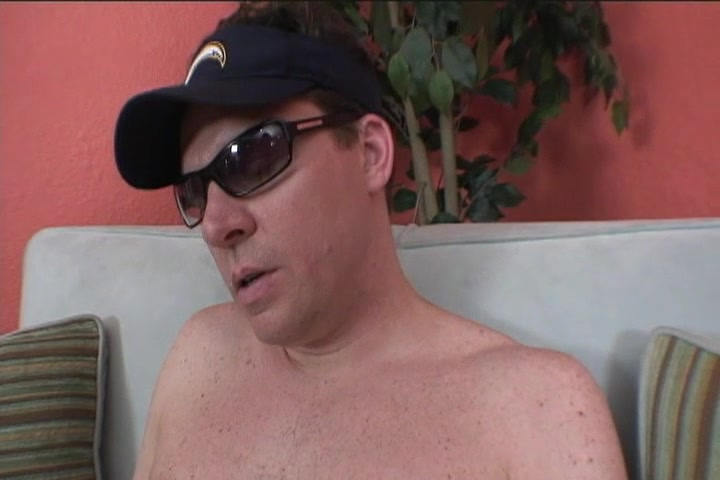 Handsome beefcake Mike Dark wearing glasses during the initial couch interview