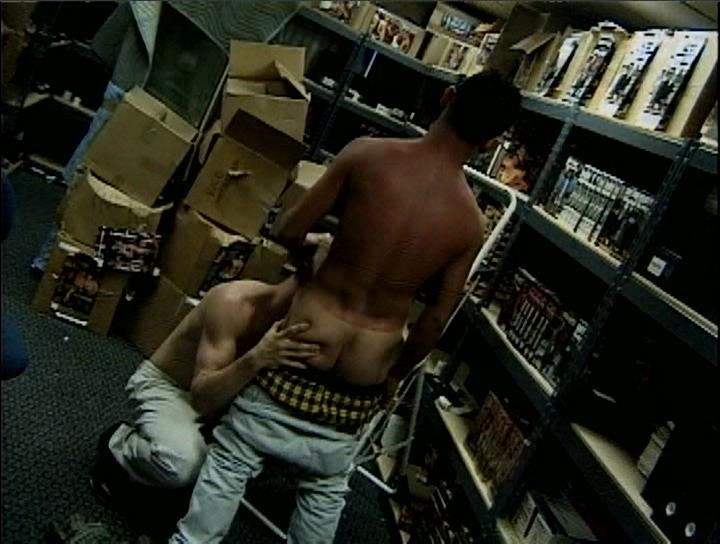 Tim Bailey performing deep oral worship and admiring his partner's dick inside the stock room