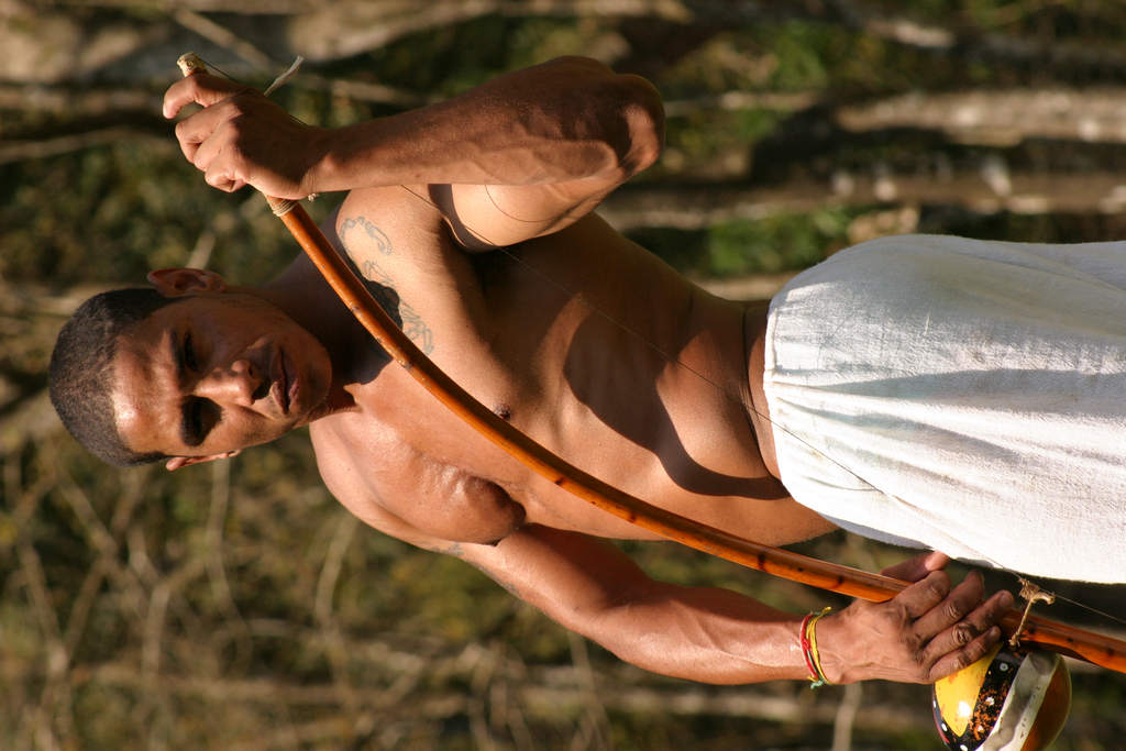 An athletic black hunk going down on a massive rod, delivering a deep throat oral worship session